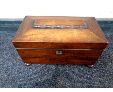 A Regency mahogany tea caddy with fitted interior  CONDITION REPORT: Section of moulding missing. 