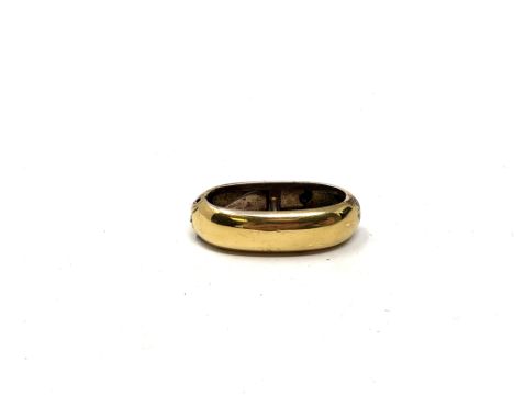 An antique yellow metal scarf clip  