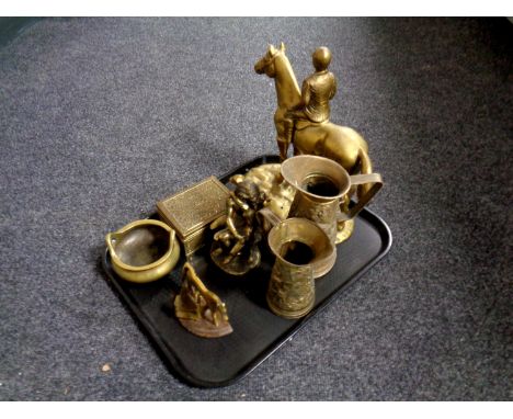 A tray containing antique and later brass ware to include embossed jugs, figure of horse and jockey, figure of the lovers, a 