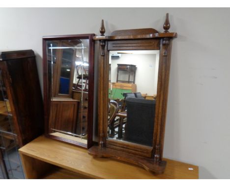 An oak framed bevel edged hall mirror with shelf and finials together with a further mahogany framed mirror  