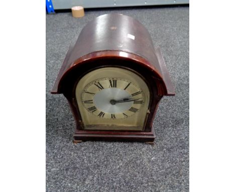 An Edwardian bracket clock with silver dial (electric)  