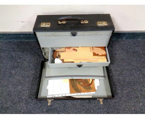 A 20th century craftsman's model case containing veneers and tools 