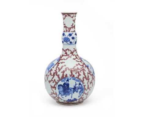 A RARE CHINESE RED, BLUE AND ANHUA DECORATED BOTTLE VASE, QING DYNASTY, KANGXI PERIOD (1662-1722) the globular body rising fr