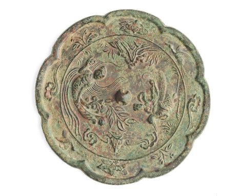 A CHINESE BRONZE MIRROR, TANG DYNASTY (618-907)  lobed and cast to the interior with a medallion enclosing Xi Wangmu and an a