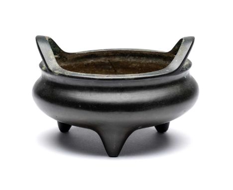 A CHINESE BRONZE TRIPOD CENSER, QING DYNASTY, 18TH CENTURY  the compressed globular body rising from three short conical feet