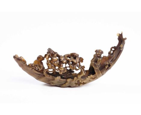 A CHINESE BUFFALO HORN 'PEACH TREE' LOG RAFT, QING DYNASTY, 19TH CENTURY  the crescent-shaped raft is formed from a large pea