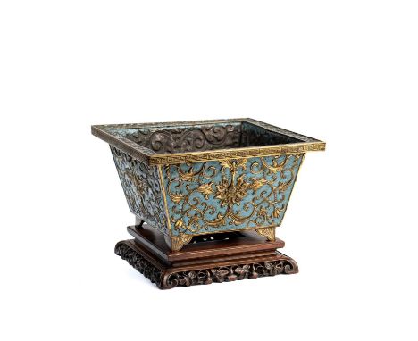 A CHINESE GILT-COPPER AND CHAMPLEVE ENAMEL JARDINIERE, QING DYNASTY (1644-1911) the square flaring body rising from a flat ba