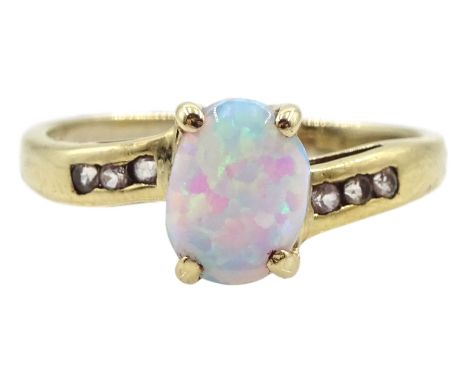 9ct gold single stone oval opal ring with cubic zirconia set shoulders, hallmarked Condition Report:Approx 2.2gm, size N, goo