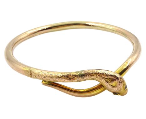 Early 20th century gold snake arm bangle, stamped 9ctCondition Report:Approx 12.05gm, dents throughout (does not appear to ha