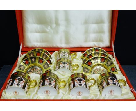 A Royal Crown Derby, Imari pattern 1128 fine bone china cabaret set, comprising six coffee cans and saucers in its fitted cas