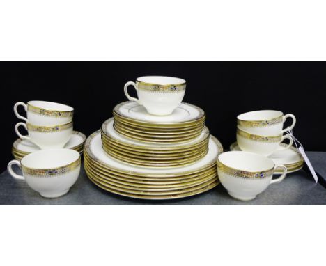 A Minton Caliph patterned fine bone china dinner set, comprising seven plates, seven medium plates, seven side plates, seven 