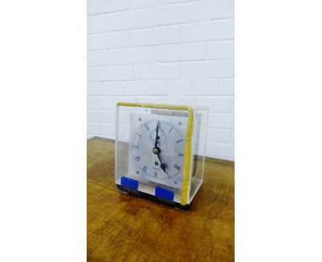 A Kosmoid time recorder clock face with a silvered dial and Roman numerals contained within a perspex case, 20 x 18cm 