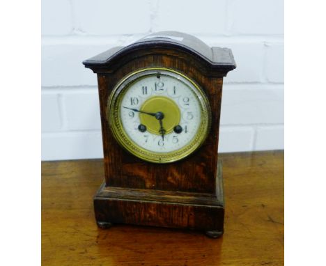 An oak cased mantle clock 