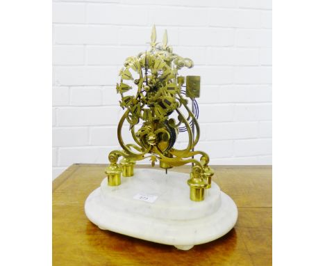 A brass skeleton clock, the fusee movement striking on the hour with Roman numerals to the dial on a stepped white marble bas