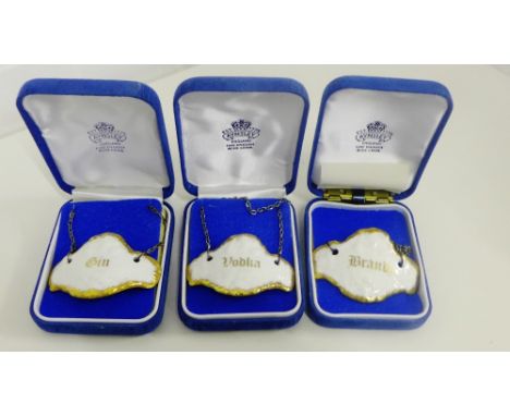 A collection of three Aynsley white glazed and gilt edged porcelain decanter labels to include, Brandy, Vodka & Gin (3) 