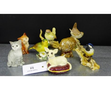 A collection of animal figures, to include a Beswick dog on a cushion, a green finch, two cats and a Gleneagles Scotch Whisky