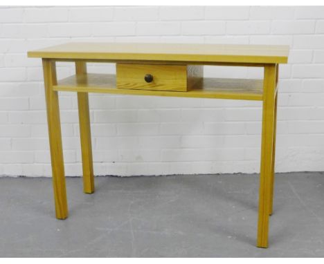 A contemporary light oak console table with a rectangular top over a single short drawer on square tapering supports, 100 x 7