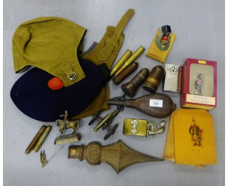 A mixed lot to include Army caps, shell cases, various militaria to include painted plaques, a miniature figure of a Highland