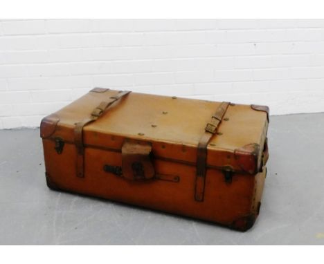 A vintage brown leather travelling trunk, 32 x 84cm