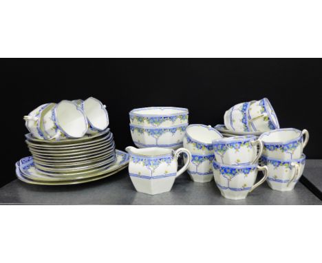 A Royal Doulton Arvon patterned Art Deco tea set, the hexagonal shaped set painted with blue, yellow and green floral sprays 