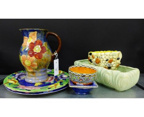 A Royal Doulton jug, together with a collection of Maling potteries to include two plates and three trinket dishes, a Sylvac 
