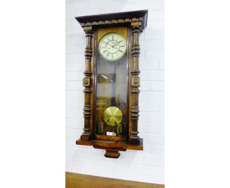 A mahogany cased wall clock, the enamel dial with Roman numerals, 100 x 50cm
