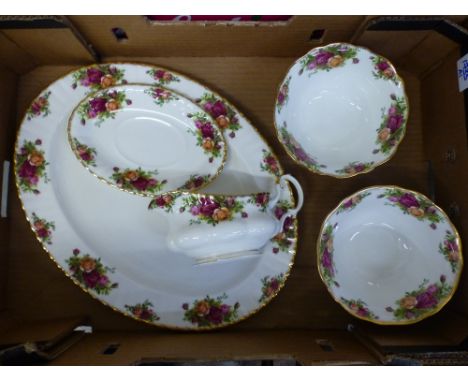 Royal Albert Old Country Roses pattern dinner ware to include a large oval platter, gravy boat and saucer and two footed bowl