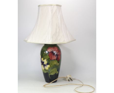 Moorcroft Hibiscus on Green Ground Lamp. a/f large crack to body. (H: approx. 63cm)