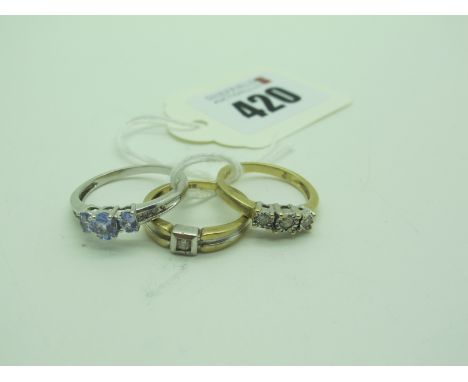 Am Illusion Set Three Stone Ring, between plain shoulders, stamped "375" "Dia" (finger size M), another similar (finger size 