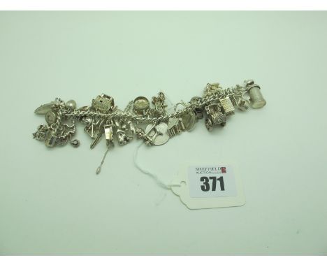 A Curb Link Bracelet, fastener stamped "Silver", assorted novelty charm pendants, including bagpipes, cuckoo clock, sewing ma