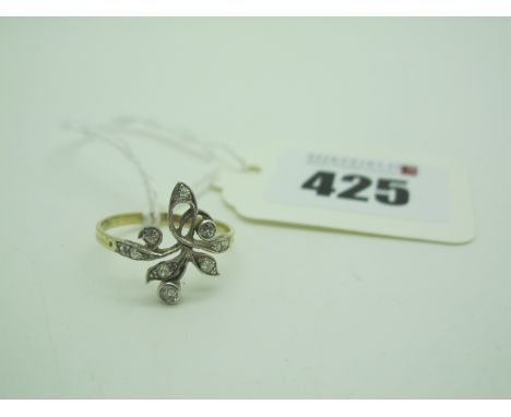 An Edwardian Style Diamond Set Openwork Ring, set with old cut stones, stamped "18K" (finger size Q) (1.9grams). 