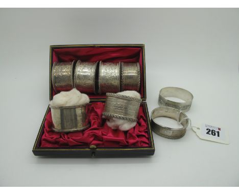 A Pair of Hallmarked Silver Napkin Rings, with gadrooned edge and engine turned decoration, contained in a plush lined fitted