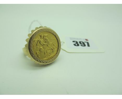 A George V Sovereign, 1915, loose set within 9ct gold ring mount (shank misshapen) (overall weight 16.5grams). 