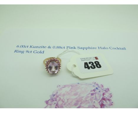 A QVC Oval Cut Kunzite Ring, within claw set pink sapphire border, stamped "375" (finger size L) (5grams).