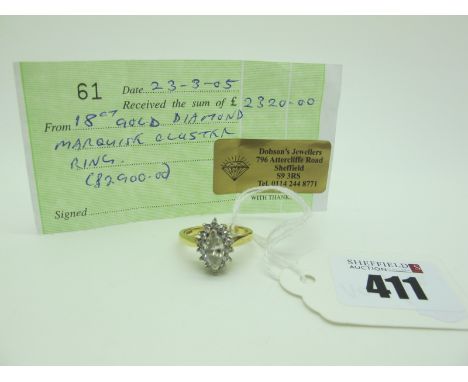 A Modern Marquise Cut Diamond Cluster Ring, claw set to the centre, within claw set border of brilliant cut diamonds, stamped