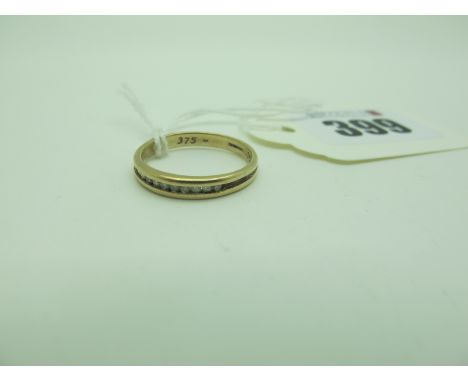 A 9ct Gold Diamond Set Half Eternity Style Ring, channel set, stamped ".15" (finger size N) (1.7grams). 