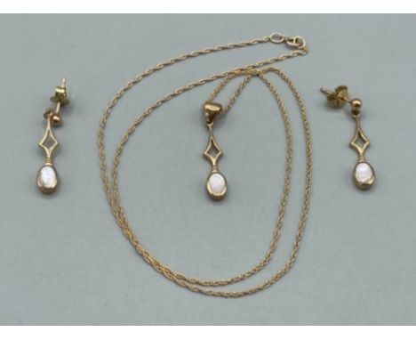 Ladies 9ct yellow gold pendant and chain with matching drop earrings 4g gross