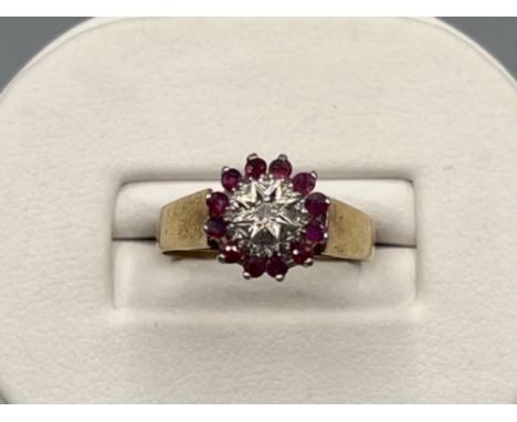 Vintage ladies 9ct gold Ruby and diamond cluster ring. Size P (3G)