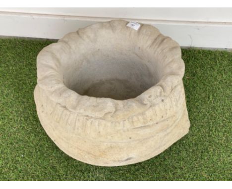 Large concrete garden planter in the form of a sack