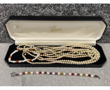 Lotus pearl box containing 3 pearl necklets (1 with 9ct gold clasp) and 2 pearl bracelets
