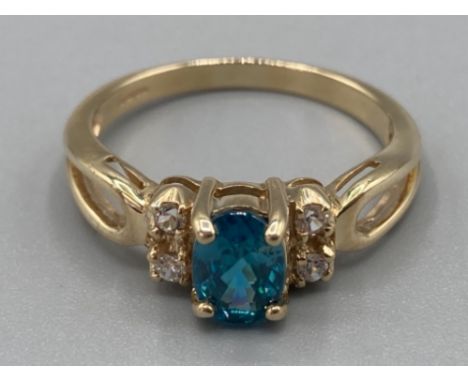 Ladies 9ct yellow gold blue topaz and CZ ring size P 3.1g gross