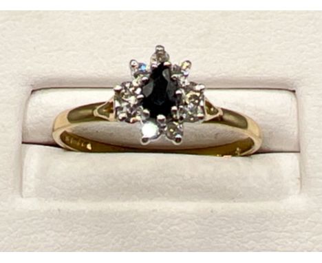 Ladies 9ct gold sapphire and white stone cluster ring. Size Q (1.6g)