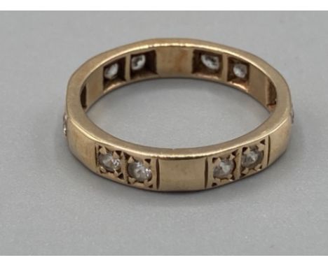 Ladies 9ct yellow gold and white stone set band size K 2.4g gross