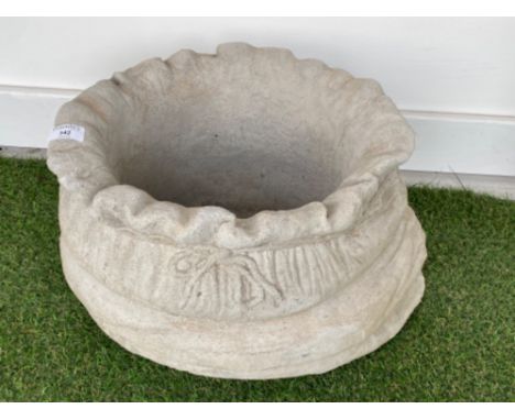 Large concrete garden planter in the form of a sack