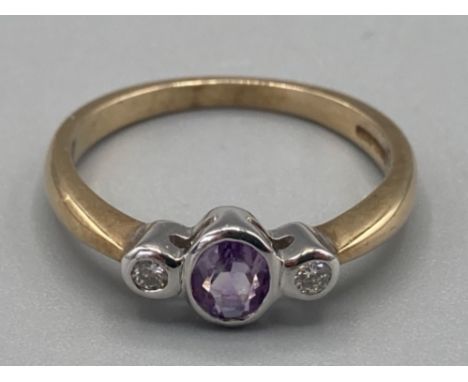 Ladies 9ct yellow gold light purple stone and diamond three stone ring size O 2.3g gross