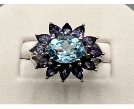 Ladies 9ct white gold blue and purple large fancy cluster ring. Size M (4g)