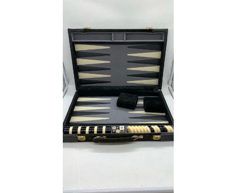 A backgammon set in a carry case 