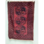 Two Afghan red ground rugs, larger 170 x 120cm***CONDITION REPORT***PLEASE NOTE:- Prospective buyers
