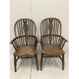 A pair of ash and elm Windsor wheel back armchairs, width 58cm, depth 48cm, height 112cm***CONDITION