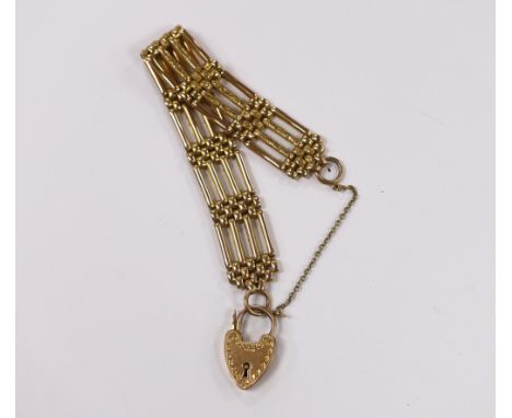 An early 20th century 9ct gate link bracelet, with heart shaped padlock clasp, 18cm 26.6 grams.***CONDITION REPORT***PLEASE N